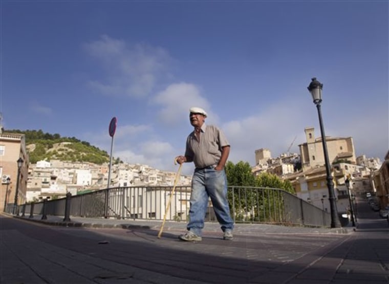 A man walks in Moratalla, a small agricultural center and rural tourism destination of just 8,500 people in Spain on Thursday. 